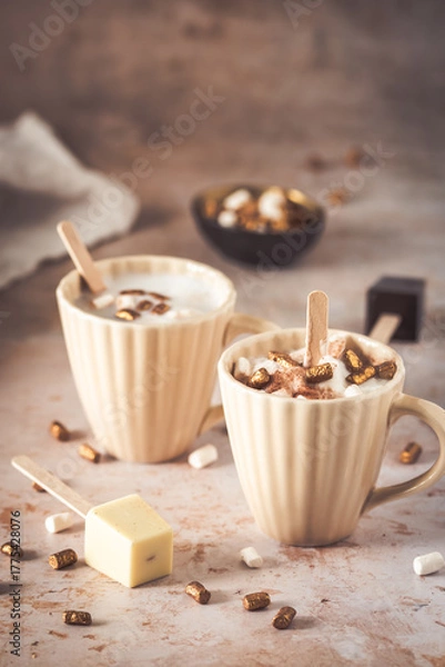 Fototapeta Two cups with hot chocolate dipping sticks and marshmallows