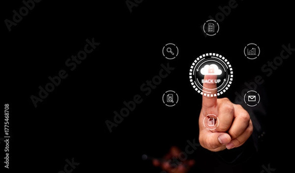 Fototapeta A hand pressing a digital "BACK UP" button surrounded by icons, symbolizing data management and technology.