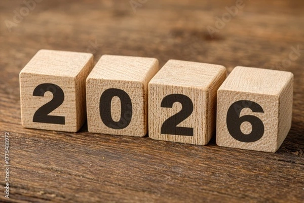 Fototapeta Wooden Blocks Spell Out The Year 2026 On A Rustic Wooden Surface Symbolizing The Upcoming New Year And Future Prospects