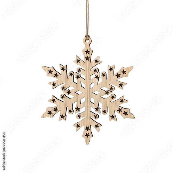Fototapeta Wooden snowflake Christmas ornament with star cutouts hanging by twine.