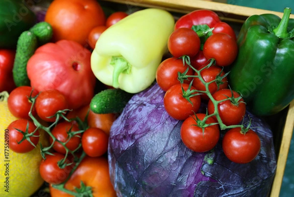 Obraz Fresh and appetizing vegetable presented at a agricultural products fair. Selective focus. Photographed in natural light.