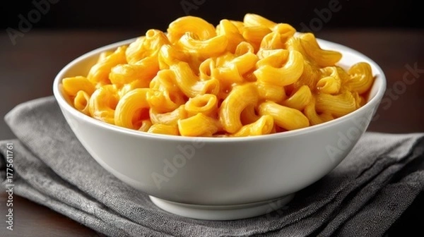 Obraz Delicious creamy macaroni and cheese in a white bowl on a dark napkin