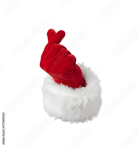Fototapeta A red Santa Claus glove with a white fur cuff, making a heart shape with fingers. Isolated on a transparent background.