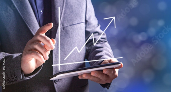Obraz hand holding a chart with an arrow pointing up