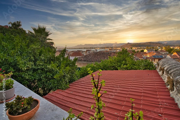 Obraz Sunset View Over Tiled Rooftops and Gardens in Nafplio, Greece