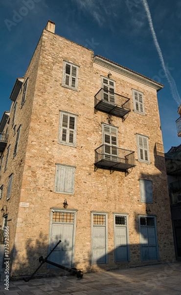 Obraz Historic stone building with blue shutters in Nafplio, Peloponnese, Greece