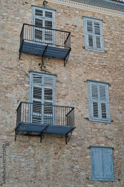 Obraz Historic stone building with blue shutters in Nafplio, Peloponnese, Greece