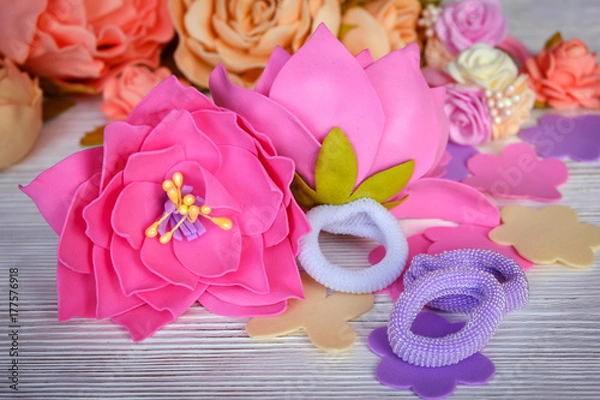 Obraz Flowers of FoamIran. Hair ornaments elastic bands on a wooden table. In a retro style.