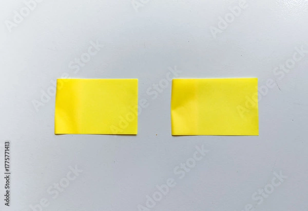 Obraz Isolated minimalist setup with two parallel yellow sticky notes on white background. Ideal for business planning, project management, and idea prototyping.