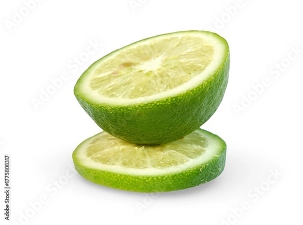 Fototapeta Creative arrangement of one lime half and two separate slices, showcasing the fresh pulp, isolated on white.