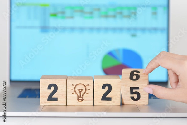 Obraz 2025 end year to Happy New Year 2026 block with lightbulb icon against computer laptop background. Business Idea, Creative, Thinking, brainstorm, Goal, Resolution, strategy, plan, Action and change