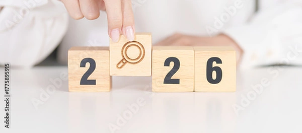 Fototapeta 2026 year block with magnifying glass icon. SEO, Search Engine Optimization, hiring , Advertising, Idea, Strategy, marketing, Keyword, Content and New Year start concepts