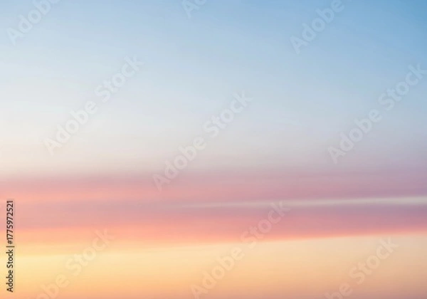Obraz A minimalist dawn sky with a smooth gradient from soft peach near the horizon to pale blue above. No harsh contrasts, only gentle color transitions and diffused light. The atmosphere is calm and open,