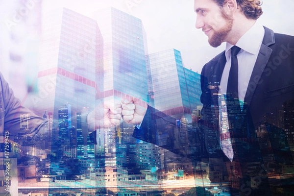Fototapeta Double exposure Businessman with Partnership Team Giving Fist Bump after complete deal. Successful Teamwork Partnership in an Office