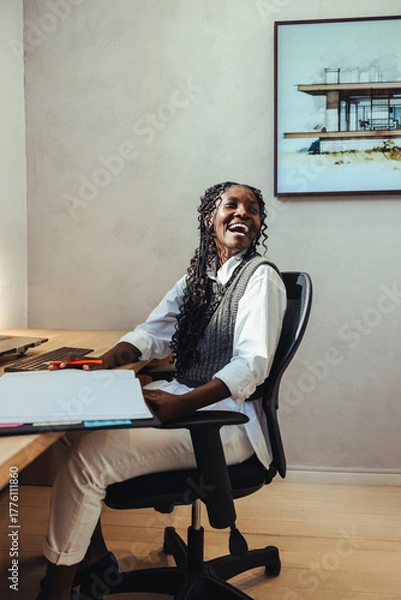 Obraz Happy architect working at a desk in a modern office space