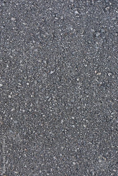 Fototapeta High-resolution asphalt road texture with small gravel details. Ideal for use in urban design, construction backgrounds, mockups, or material textures for digital and graphic projects.