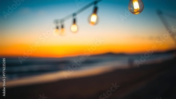 Obraz Sunset beach with soft-focus hanging lights, evoking a serene and dreamy coastal atmosphere.