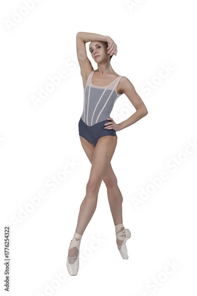 Obraz ballerina with beautiful feet poses in a photo studio, a ballerina in a leopard walks with her arms up