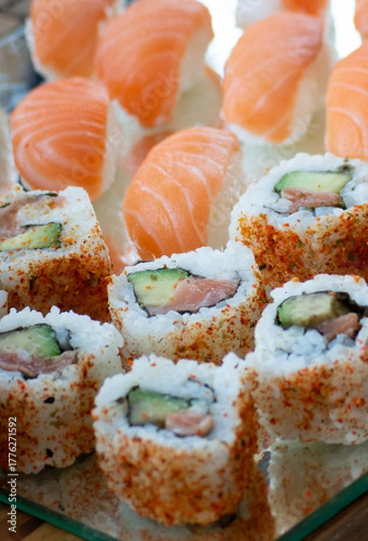 Fototapeta close up of sushi with salmon and wasabi