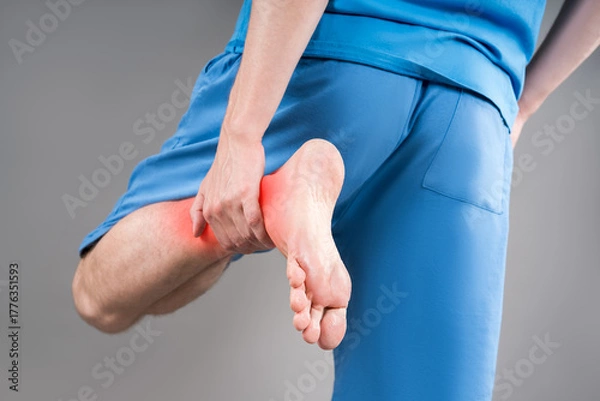 Obraz Achilles tendon injury, joint inflammation, foot pain, man suffering from feet ache, podiatry concept