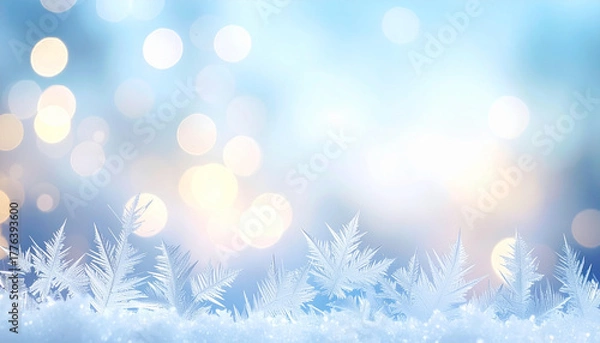 Fototapeta Abstract winter background featuring intricate ice frost crystals on a snowy landscape with magical blue and gold bokeh lights