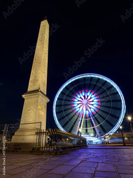 Obraz The Luxor Obelisk and the Ferris Wheel at night, located in the Place de la Concorde in the center of Paris.