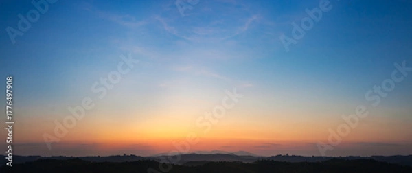 Fototapeta Panorama view of sunrise over the mountain with beautiful blue sky.