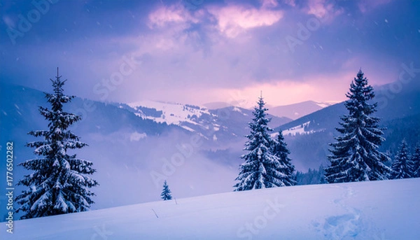 Obraz Winter Wonderland: An awe-inspiring vista of snow-covered pine trees, rolling hills and distant mountains under a dramatic, twilight sky.