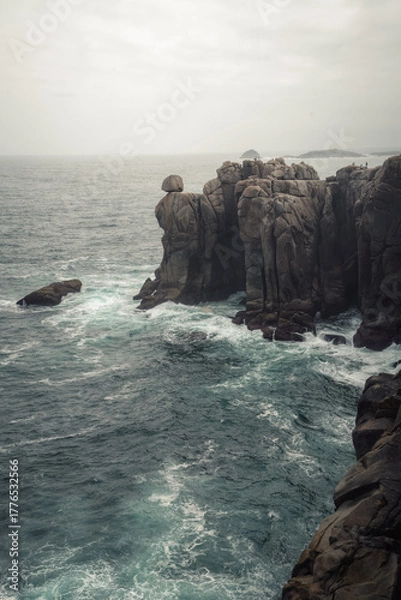 Obraz Steely sea under a cloudy sky over the granite cliffs