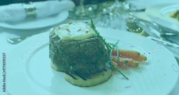 Fototapeta Showcasing seared steak on bread round on plate at dining table, with baby carrots and salicornia