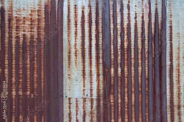 Fototapeta Rusty metal sheet zinc sheet textured wall fill with beautiful rust