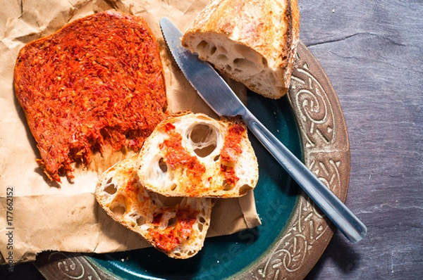 Obraz Spicy Italian Nduja Calabrian sausage served with rustic home baked sourdough bread.