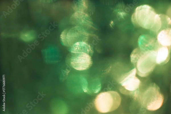 Fototapeta Green and yellow bokeh effect, photo for cover design, festive New Year background image, Christmas decoration