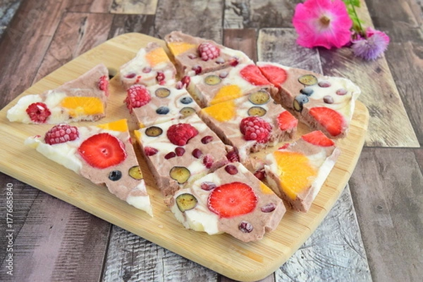 Fototapeta Frozen yogurt bark with strawberry, blueberry, pomegranate and orange