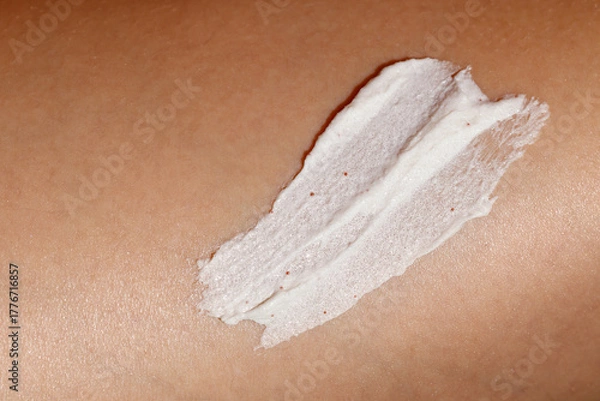 Fototapeta Close-up of a womans skin with a smear of exfoliating body scrub