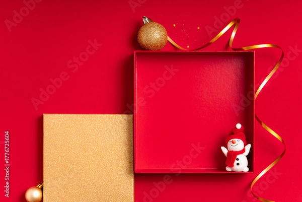 Fototapeta Red frame background with ribbon, snowman and golden panel