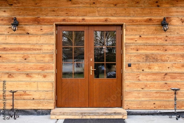 Obraz Designer entrance door to a country house. Modern design. Luxurious exterior. Facade of a modern building with modern doors.