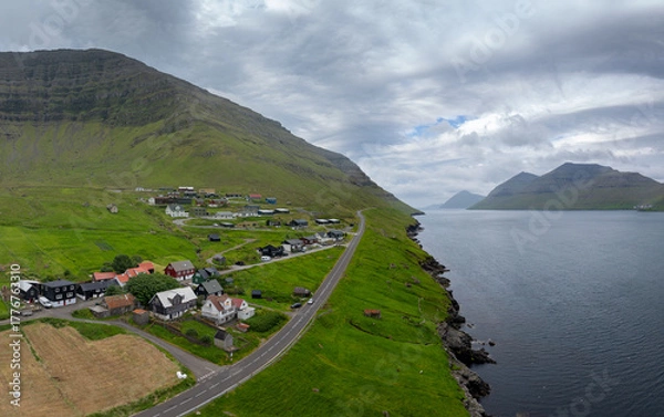 Fototapeta drone view of the Faroe Island village of Kunoy on the fjord and Kunoy Island