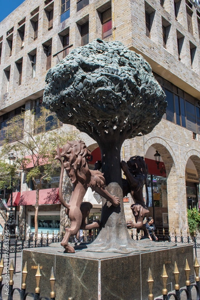 Fototapeta Guadalajara, Mexico - February 23 2025: Bronze sculpture of Guadalajara coat of arms featuring two lions and a tree in the historic center of the city