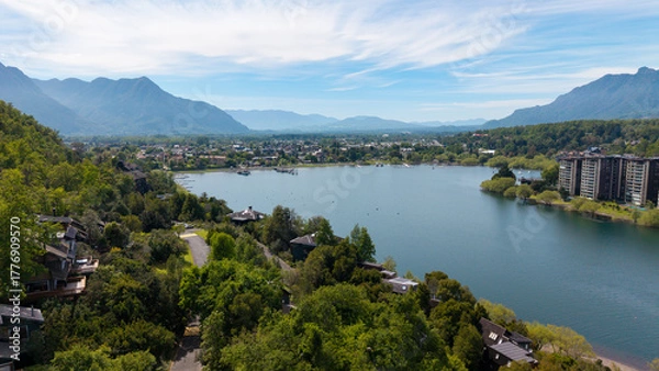Fototapeta Aerial view of the city of Pucón, in southern Chile. The Villarrica Volcano can be seen in the background.