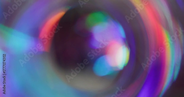 Fototapeta Iridescent blur glow. Whirl futuristic flare. Red purple blue light mixing color on black background. Neon reflection abstract luminosity.