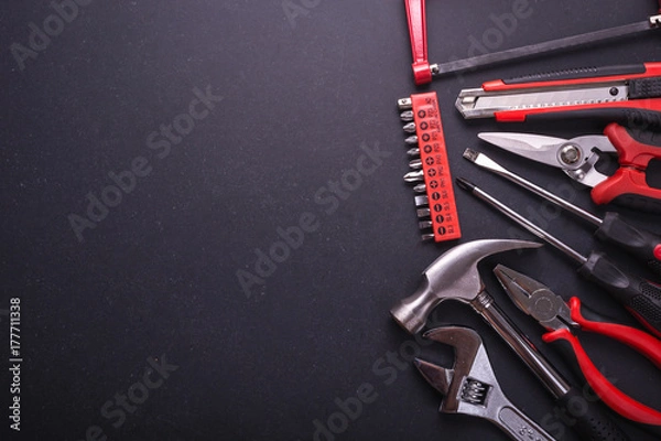 Fototapeta New square black tool box on black granite board background. Composition with free space for text or design