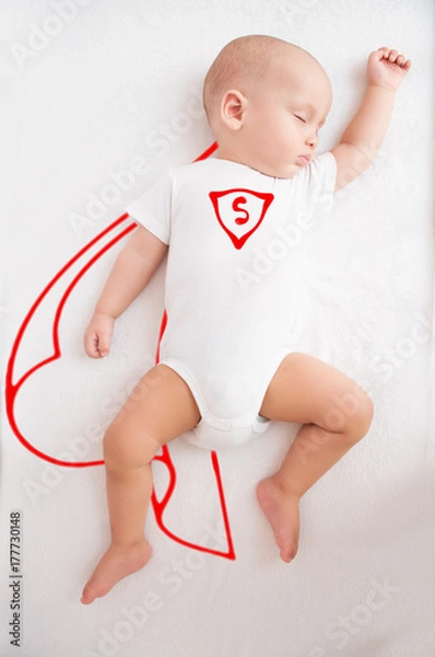Fototapeta sleeping baby, in dreams superman