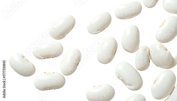Fototapeta Scattered, creamy white lima beans over a stark black backdrop