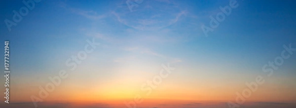 Fototapeta Sunset sky background. Panoramic view of sunset sky.