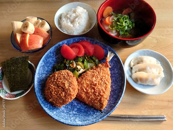 Fototapeta A classic dish found at local eateries: Mixed Fry Set Meal (fried horse mackerel and minced meat cutlet) - includes kenchinjiru soup, small dishes / 町の大衆食堂で食べる定番メニュー～ミックスフライ定食(アジフライとメンチカツ)，けんちん汁・デザート付