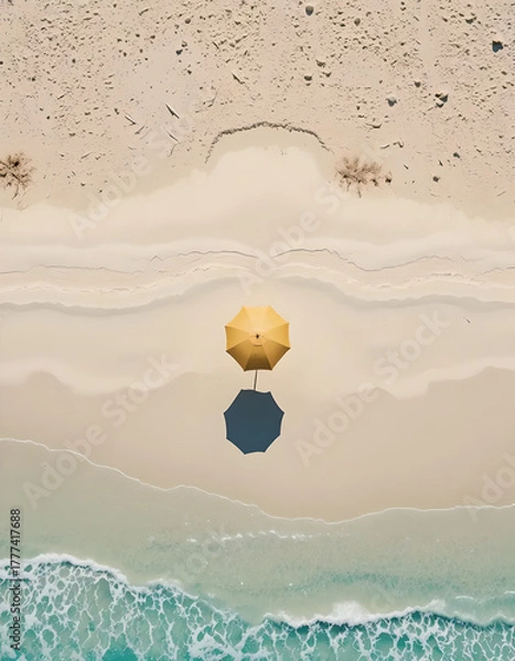 Fototapeta Aerial View of Solo Yellow Umbrella on Pristine Beach