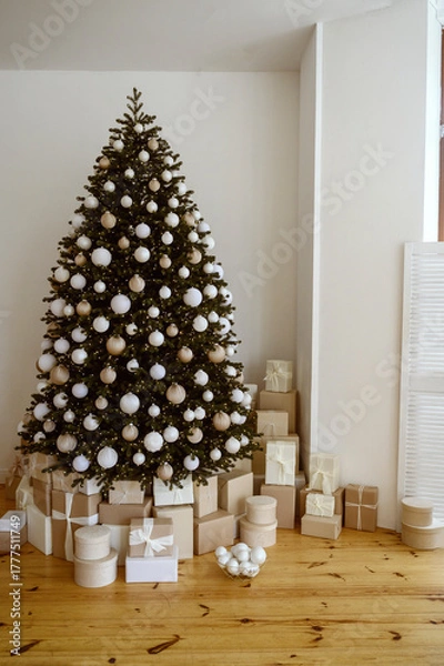 Fototapeta Beautifully decorated Christmas tree with many presents under it.