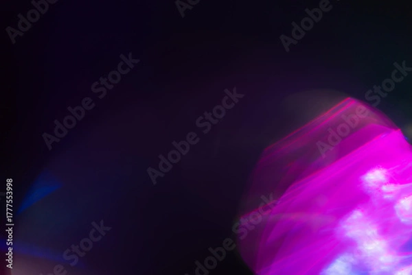 Fototapeta Colorful light leak on black background, abstract design with optical lens flare shot on a long lens