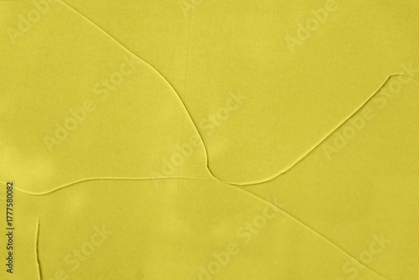 Fototapeta Minimal yellow glass texture with soft intersecting lines forming smooth geometric shapes across surface. Natural background for modern design, creative layout and visual branding